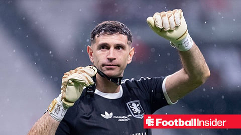 Aston Villa goalkeeper Emi Martinez holds up his Europa League winners medal