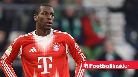 Nicolas Jackson in red Bayern Munich kit standing with hands on hips