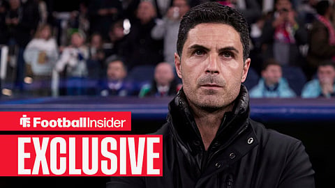 Mikel Arteta with his arms crossed looking straight ahead on the sidelines