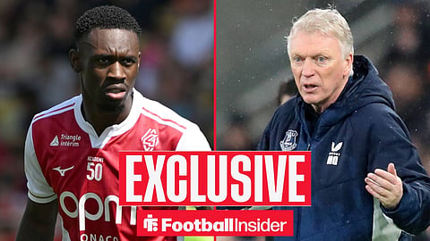 Folarin Balogun in action for Monaco frowning and looking right with David Moyes protesting on sideline in rain 