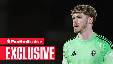 Matty Young in green goalkeeper kit playing for Salford City 