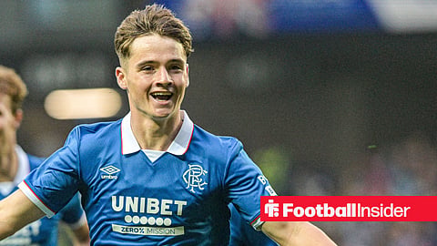 Findlay Curtis celebrating with arms outstretched in Rangers shirt smiling