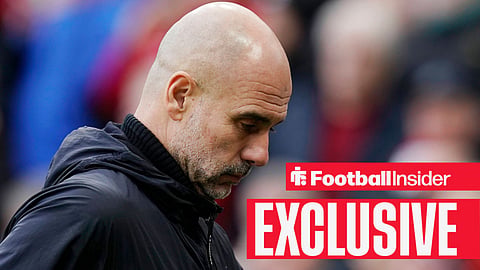 Former Manchester City manager Pep Guardiola looking down