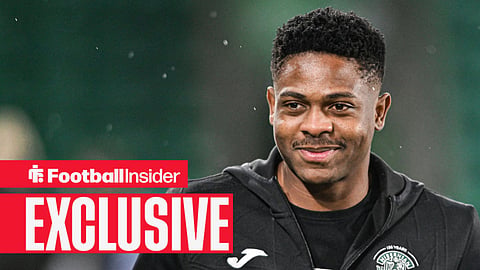 Miguel Chaiwa in Hibs training jacket smiling 