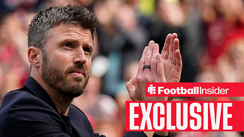 Michael Carrick clapping in stadium with black suit on