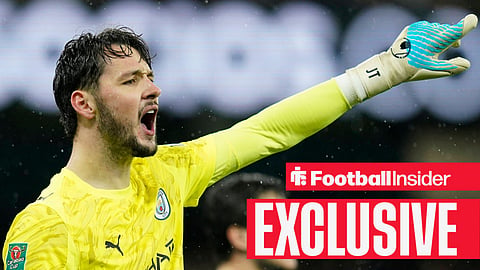 Manchester City goalkeeper James Trafford shouts and points