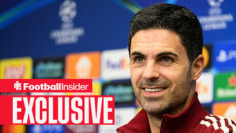 Arsenal manager Mikel Arteta smiling in a pre-match press conference