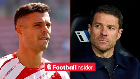 Granit Xhaka pre-match with Sunderland, with Xabi Alonso looking focused in the dugout