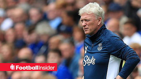 David Moyes with his hands on his hips in a blue Everton top