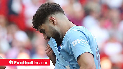 Man City defender Josko Gvardiol covers his mouth with his shirt