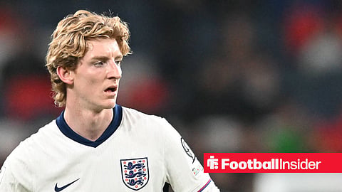 Anthony Gordon with hands on hips in England home top