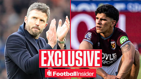 Michael Carrick clapping fans on left with Mateus Fernandes on right sat on ball looking sad