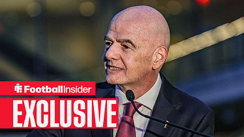FIFA president Gianni Infantino speaks into a microphone 