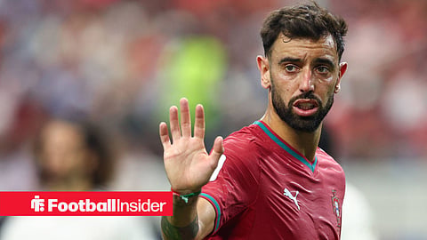 Bruno Fernandes with hand up towards Portugal teammate looking annoyed