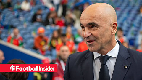 Roberto Martinez in suit inside stadium