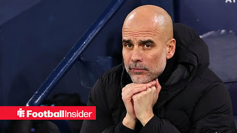 Pep Guardiola in the dugout at Man City