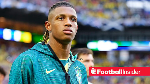 Danilo Santos walking onto pitch in a Brazil warm up jacket