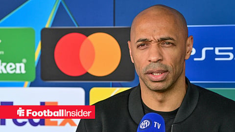 Thierry Henry in black attire being interviewed