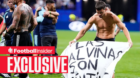 Giovani Lo Celso of Argentina celebrates the victory and holds up a banner during the FIFA World Cup 2026 Semi Final match between England and Argentina at Atlanta Stadium on July 15, 2026
