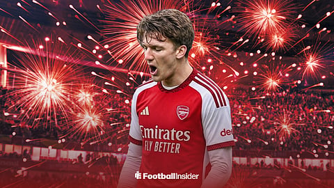 Club Brugge's Christos Tzolis in an Arsenal home shirt at the Emirates Stadium, surrounded by fireworks