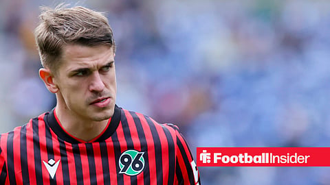Maik Nawrocki in red and black striped Hanover kit
