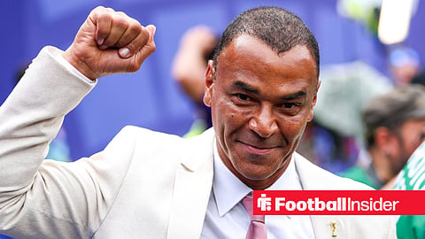 Cafu fist pumping and smiling in white suit
