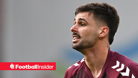 Claudio Braga playing for Hearts in maroon home kit 