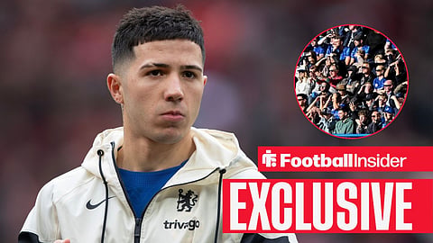 Football Insider exclusive as Chelsea midfielder Enzo Fernandez stares towards the fans, who watch from a circular inset.