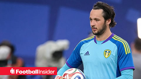 Manchester City's James Trafford in a Leeds United goalkeeper kit, holding a football