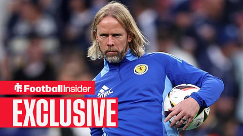 Aston Villa set piece coach Austin MacPhee holds a ball while working for Scotland