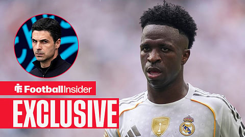 Football Insider exclusive as Vinicius Junior stares towards Arsenal manager Mikel Arteta, who watches from a circular inset.