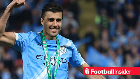 Manchester City midfielder Rodri celebrating with the Carabao Cup medal around his neck