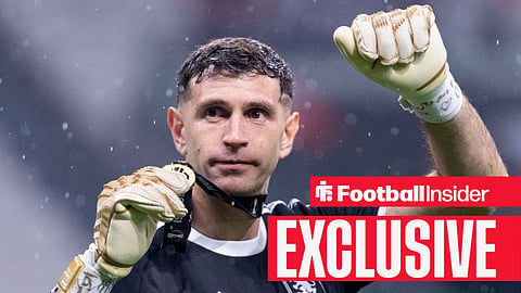 Aston Villa goalkeeper Emi Martinez holds up his Europa League medal