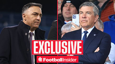 Paraag Marathe stood on pitch with Andrew Cavenagh stood in stands