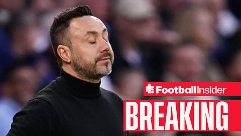 Roberto De Zerbi with his eyes closed on the sidelines at Tottenham