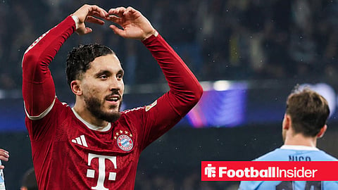 Manchester City midfielder Rayan Cherki, wearing a Bayern Munich 2026-27 home kit, scores a GOAL 4-1 and celebrates gestures to fans during the Manchester City v Borussia Dortmund UEFA Champions League Round 1 League Stage match at the Etihad Stadium, Manchester, England on 5 November 2025