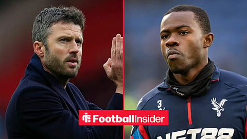 Michael Carrick applauding on the sidelines with Tyrick Mitchell pre-match for Crystal Palace