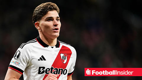 Atletico Madrid striker Julian Alvarez, wearing a River Plate 26-27 home kit, looks on