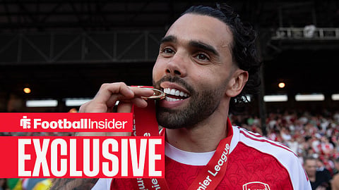 Arsenal goalkeeper David Raya bits his Premier League winners' medal