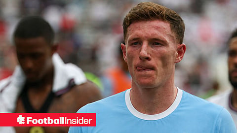 Elliot Anderson of England, wearing a Man City 2026-27 home shirt, leaves the pitch after the first half