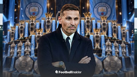 Man City chairman Khaldoon Al Mubarak stood in front of Premier League and FA Cup trophies, and Community Shields