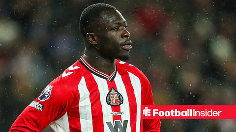 Brian Brobbey stood in action in rain