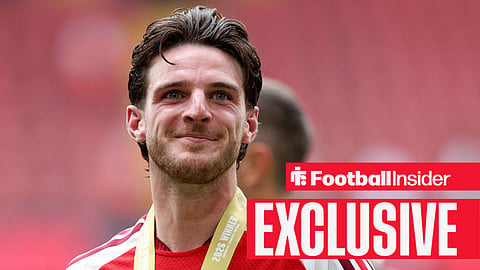 Declan Rice smiling with Community shield winners medal around his neck