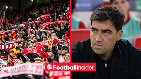 Liverpool fans holding scarves at Anfield, with Andoni Iraola on the sidelines