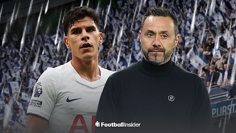 Tottenham Hotspur midfielder Mateus Fernandes standing next to Tottenham manager Roberto De Zerbi in the pouring rain at the Tottenham Hotspur Stadium