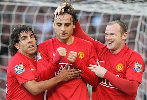 Frozen out: Carlos Tevez and Wayne Rooney do not make Berbatov's dream team