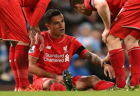 Body blow: Coutinho will be assessed when he returns to Liverpool