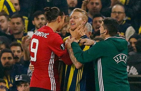Manchester United's Zlatan Ibrahimovic clashes with Fenerbahces Simon Kjaer