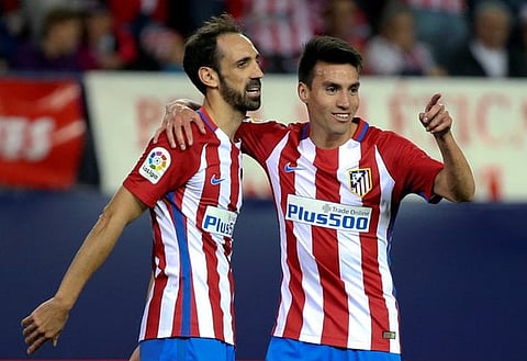 Football Soccer - Spanish Liga Santander - Atletico Madrid v Granada - Vicente Calderon stadium, Madrid, Spain, 15/10/16 Atletico Madrid's Nicolas Gaitan celebrates with team mate JuanFran Torres after scoring his second goal. REUTERS/Sergio Perez