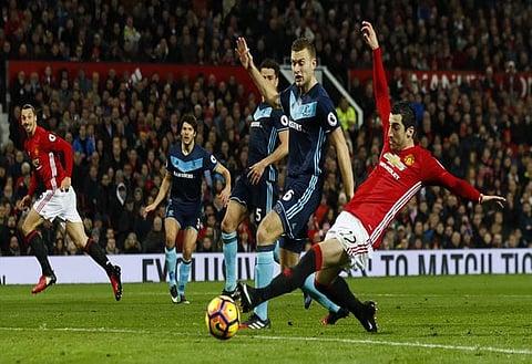 Britain Football Soccer - Manchester United v Middlesbrough - Premier League - Old Trafford - 31/12/16 Manchester United's Henrikh Mkhitaryan in action with Middlesbrough's Ben Gibson  Action Images via Reuters / Jason Cairnduff Livepic EDITORIAL USE ONLY. No use with unauthorized audio, video, data, fixture lists, club/league logos or "live" services. Online in-match use limited to 45 images, no video emulation. No use in betting, games or single club/league/player publications. Please contact your account representative for further details.